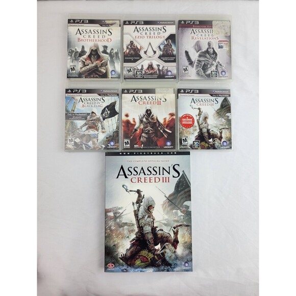 PS3 ASSASSINS CREED VIDEO GAME LOT (6) AND ASSASSINS CREED 3 BOOK
